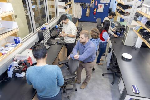 Assistant Professor Alex Adams (center) works with students to design, fabricate, and implement new ubiquitous and wearable sensing systems. Assistant Professor Alex Adams (center) works with students to design, fabricate, and implement new ubiquitous and wearable sensing systems.